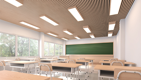 Empty school classroom with a green chalkboard Empty school classroom with a green chalkboard