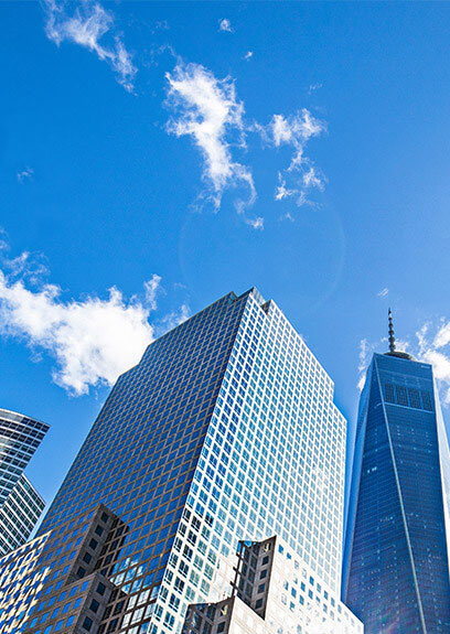 low angle shot of high rise buildings with blue sky