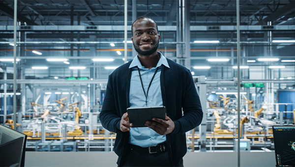 Man working on a tablet in a warehouse