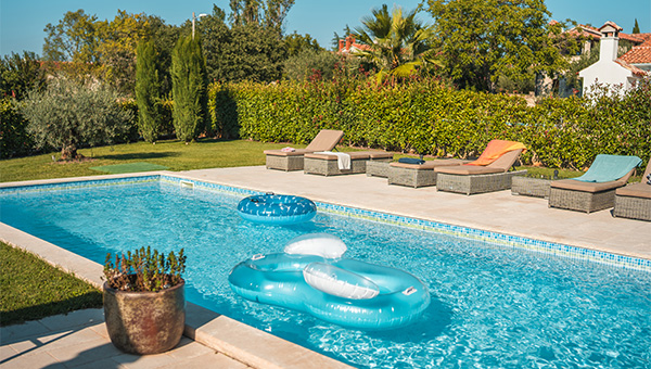 Residential swimming pool with pool chairs