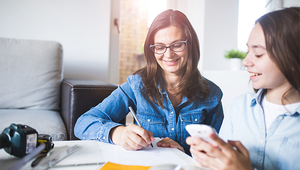 Mother and daughter smiling