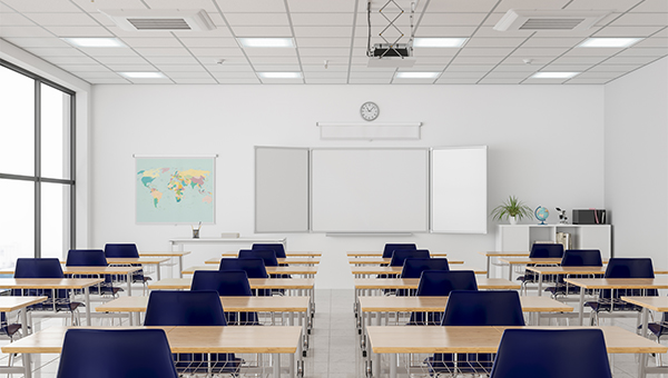 Empty school classroom with a whiteboard