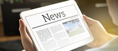Man reading the news on iPad