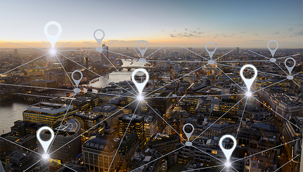 Aerial view of a city at dawn with different location icons