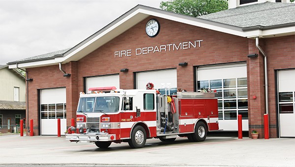 Fire truck parked outside of the fire department