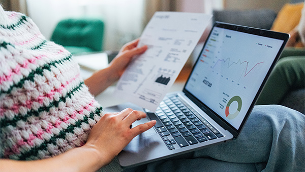 Woman looking at her energy bill on her laptop