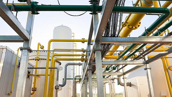 yellow natural gas pipelines at a plant