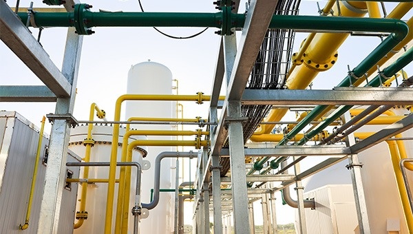 yellow natural gas pipelines at a plant